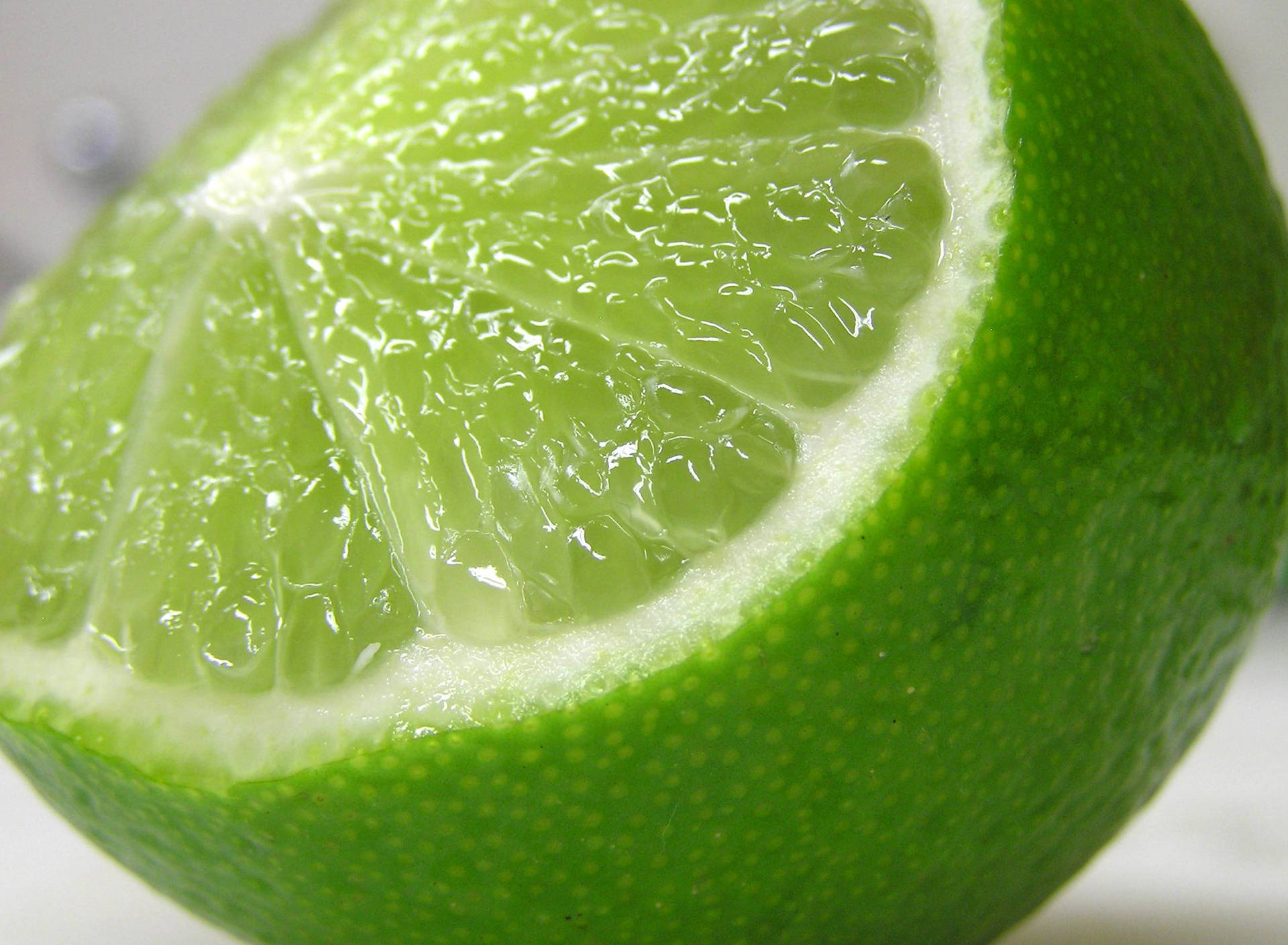 Freshly Cut Green Lime Fruit Wallpaper