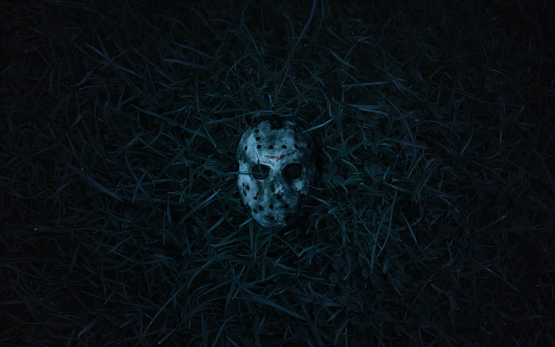 Friday The 13th Mask In Grass Wallpaper