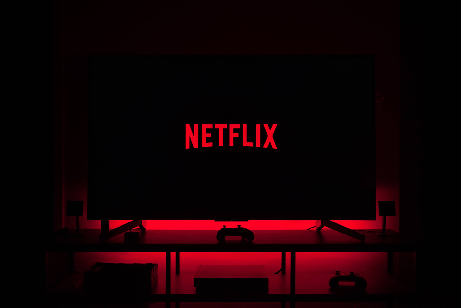 Friends Enjoying A Netflix Movie Night Wallpaper