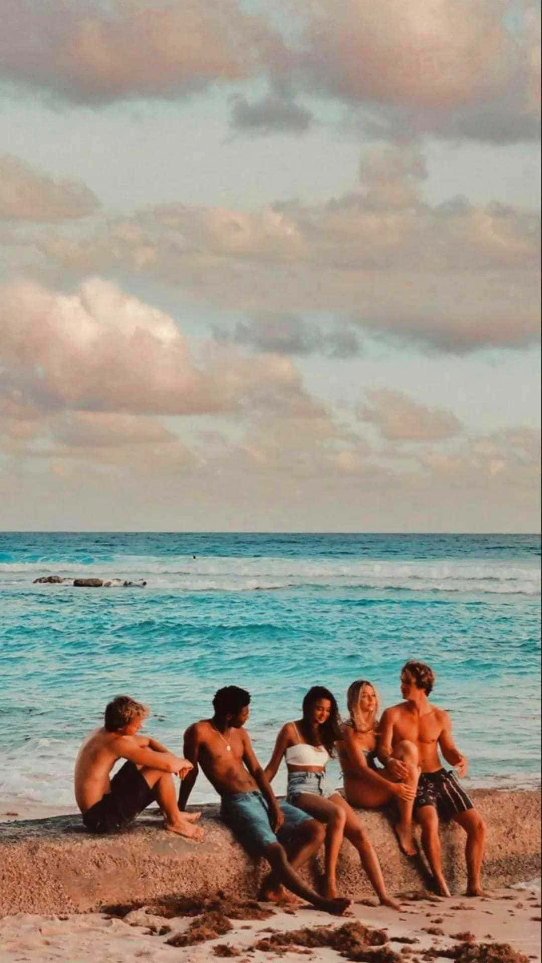 Friends Enjoying Beach Sunset Wallpaper