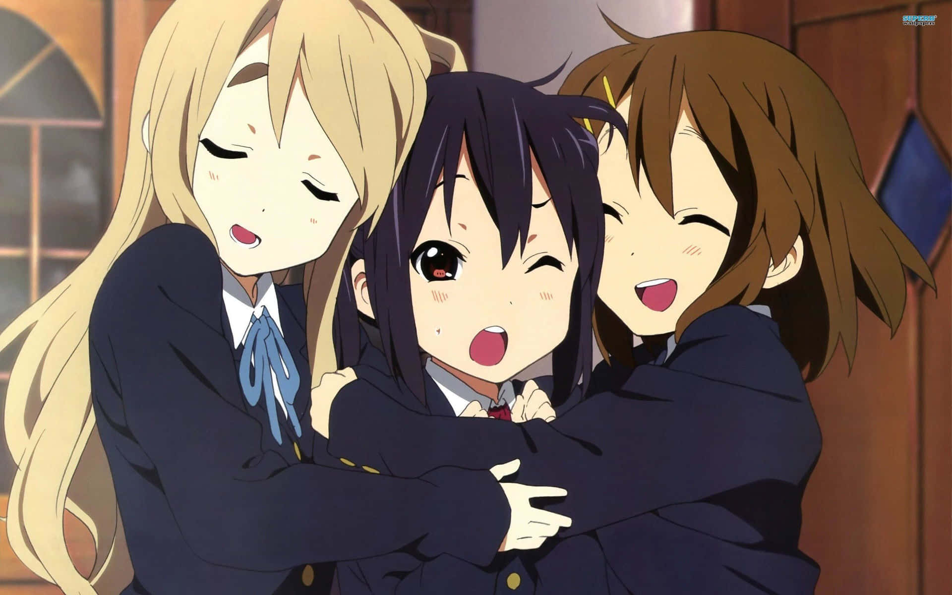 Tre anime piger der omfavner hinanden