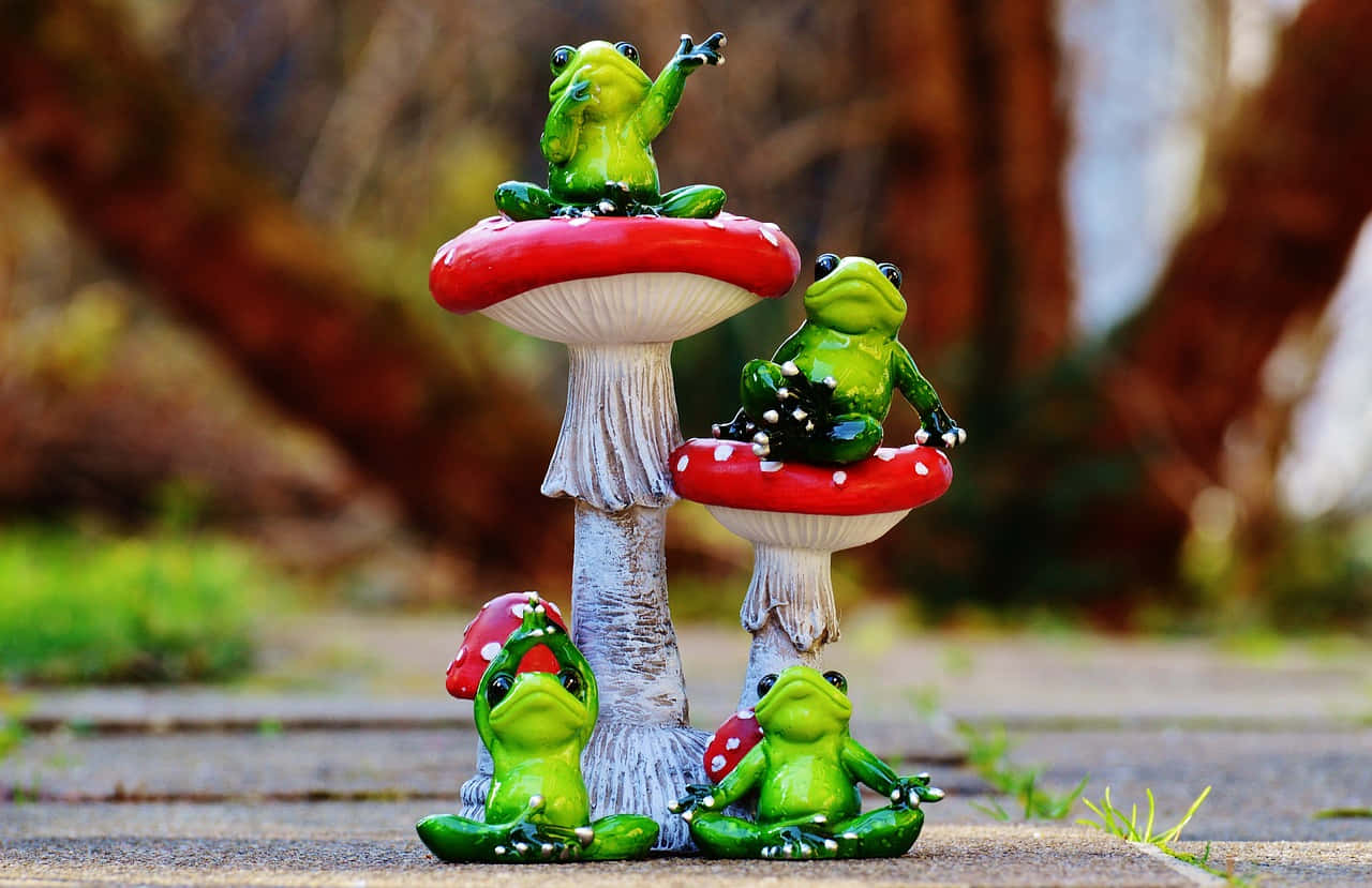 Frog_ Figurines_ On_ Mushrooms.jpg Wallpaper