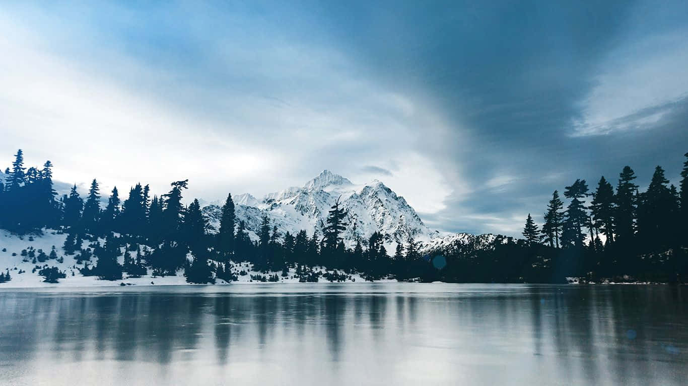 Serene Winter Landscape with Frozen Lake Wallpaper