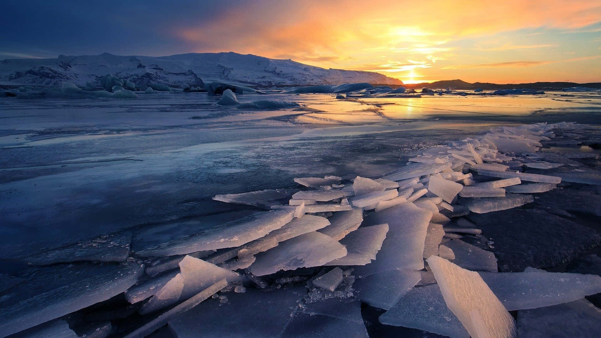 Enchanting Sunset Over a Frozen Lake Wallpaper