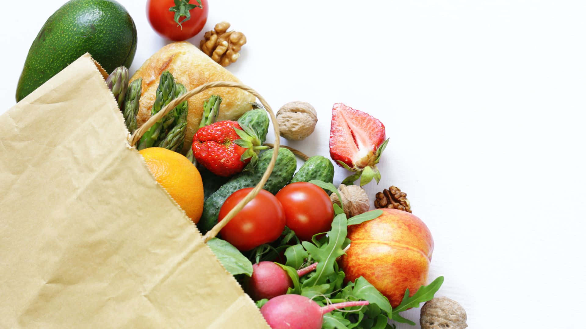 A Paper Bag Filled With Fruits And Vegetables