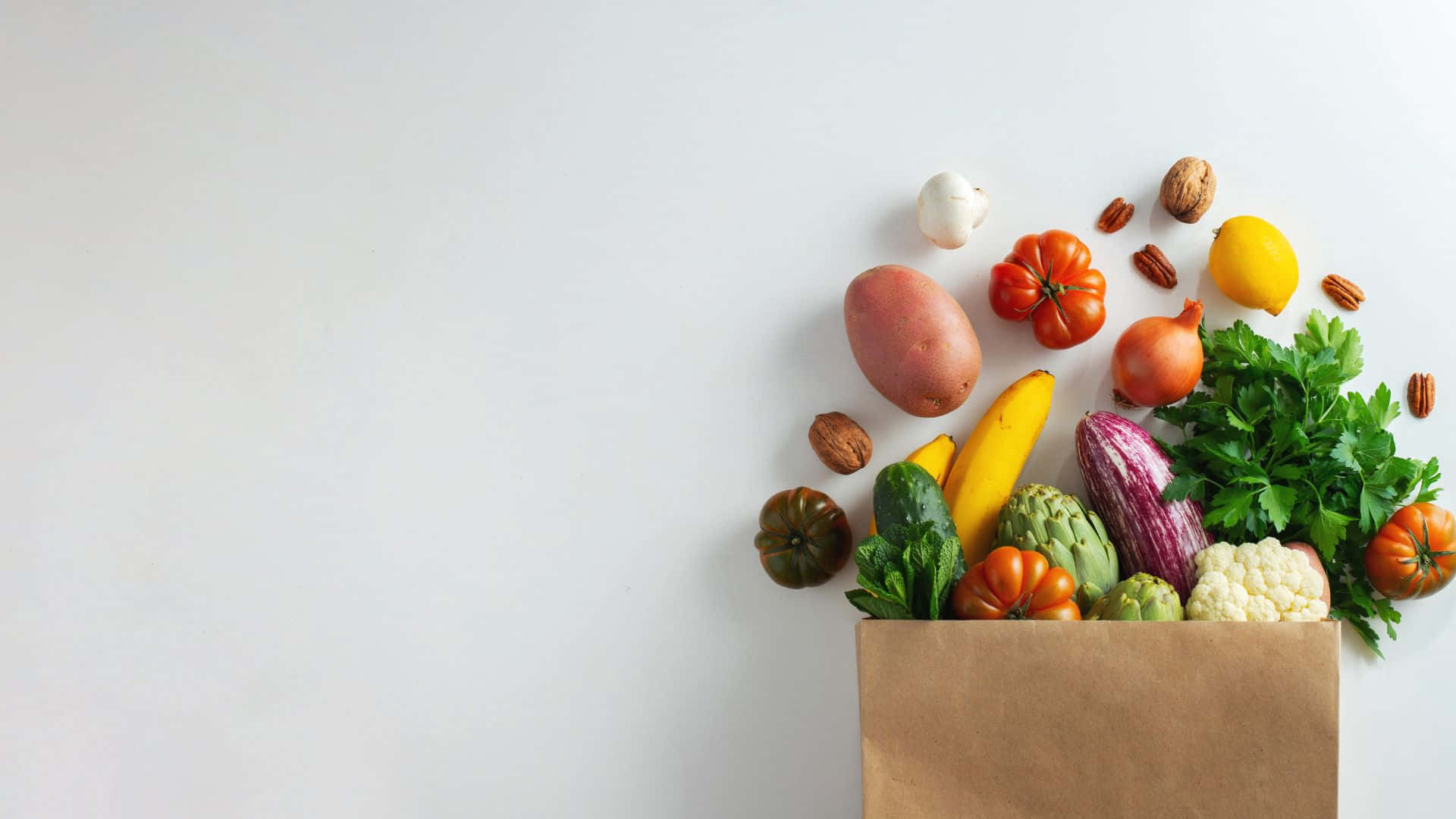 A Paper Bag Filled With Vegetables And Nuts