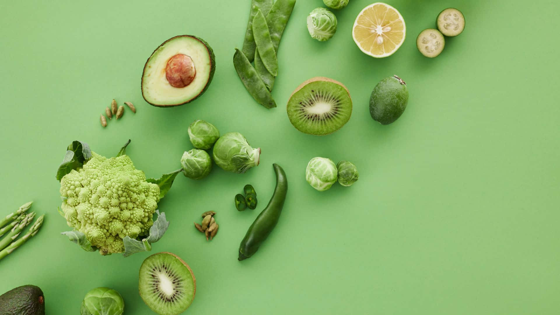 A Green Background With Various Vegetables And Fruits