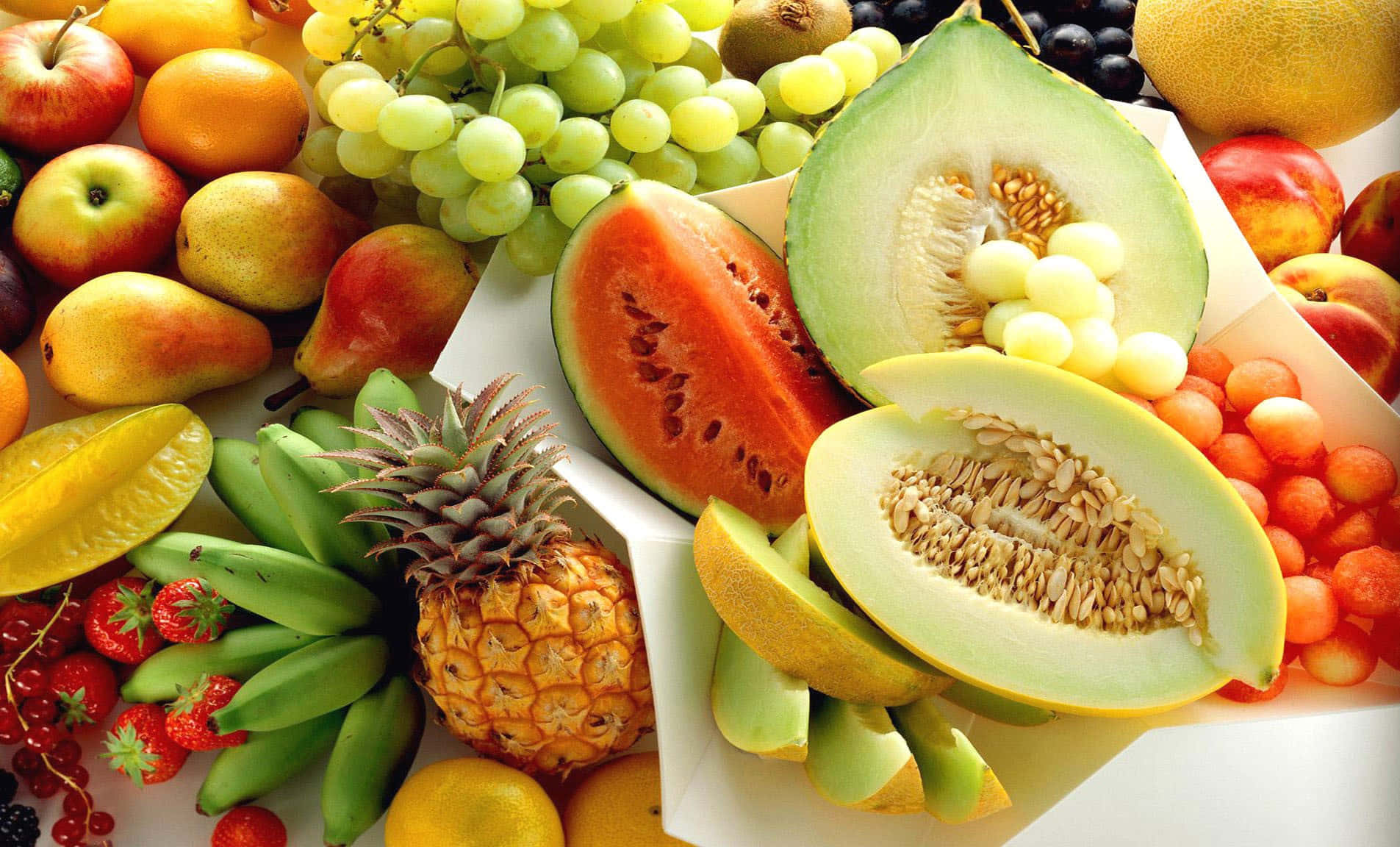 A Bunch Of Fruit On A White Plate