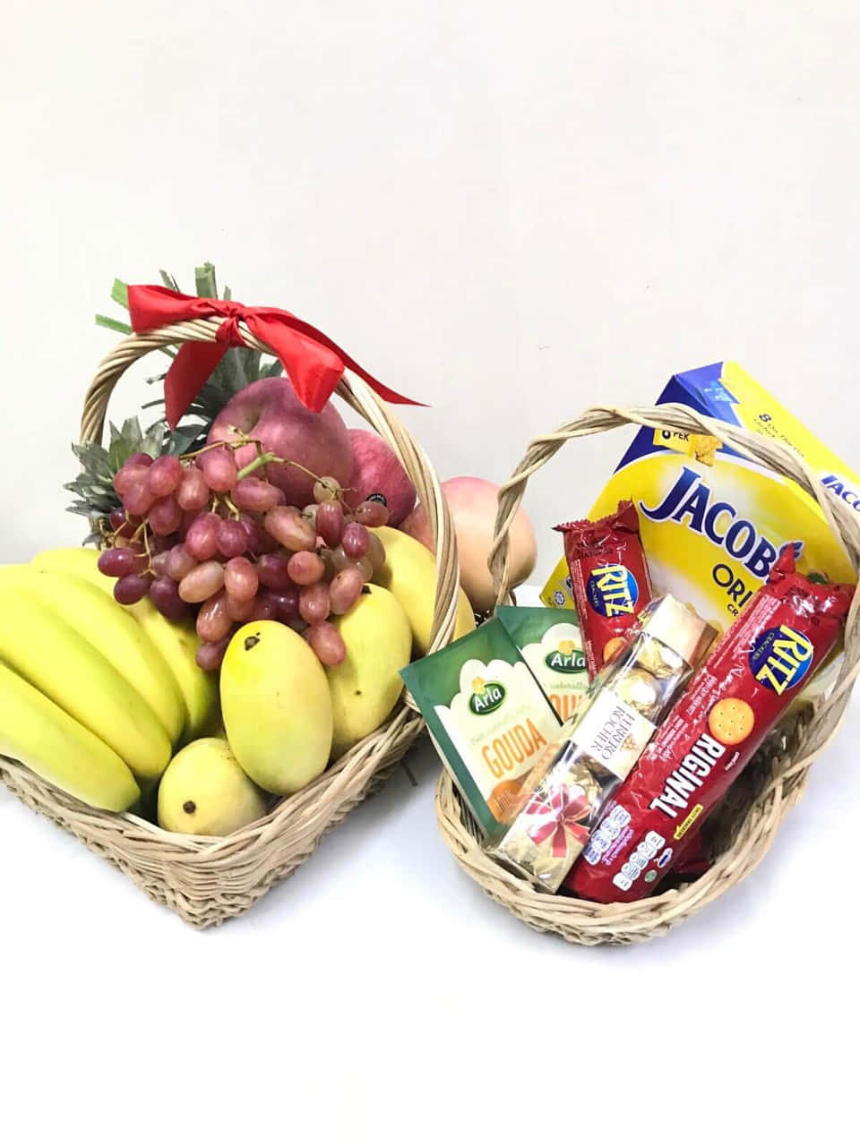 A Basket Of Fruit And Snacks