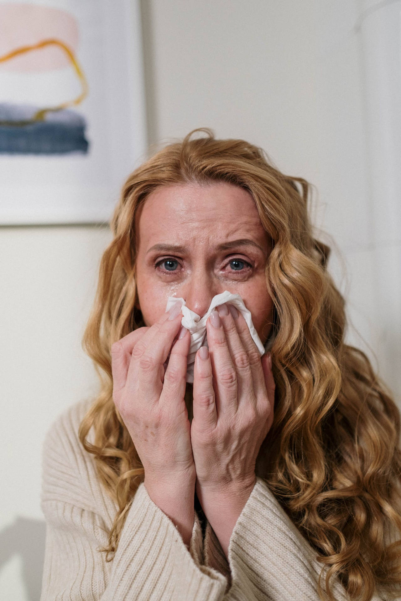 Frustrated Woman Holding Sneeze Wallpaper