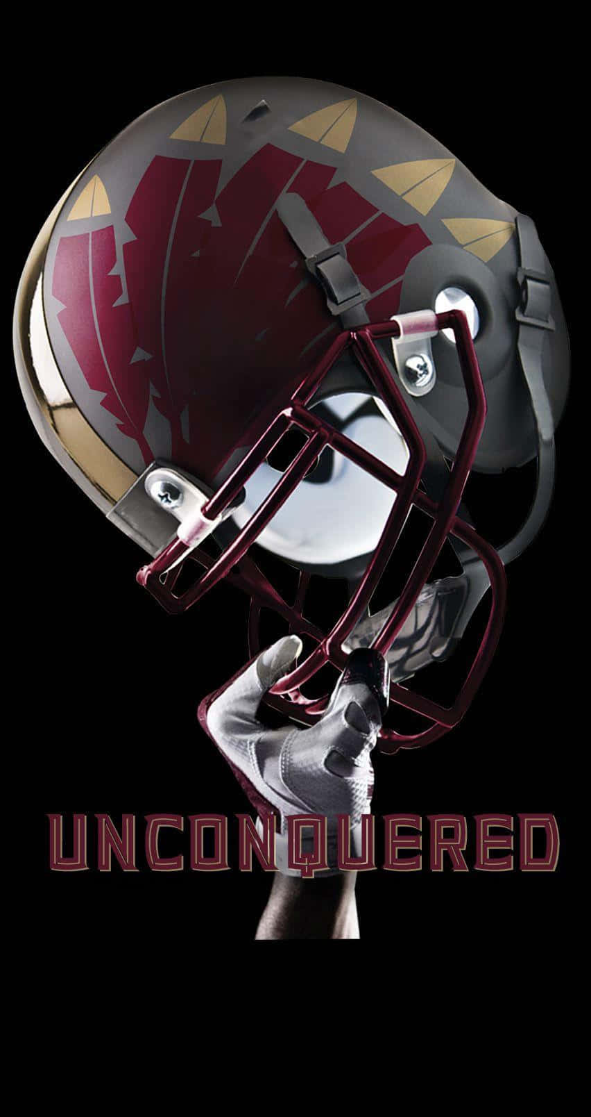 A Helmet With The Word Unconquered On It Wallpaper