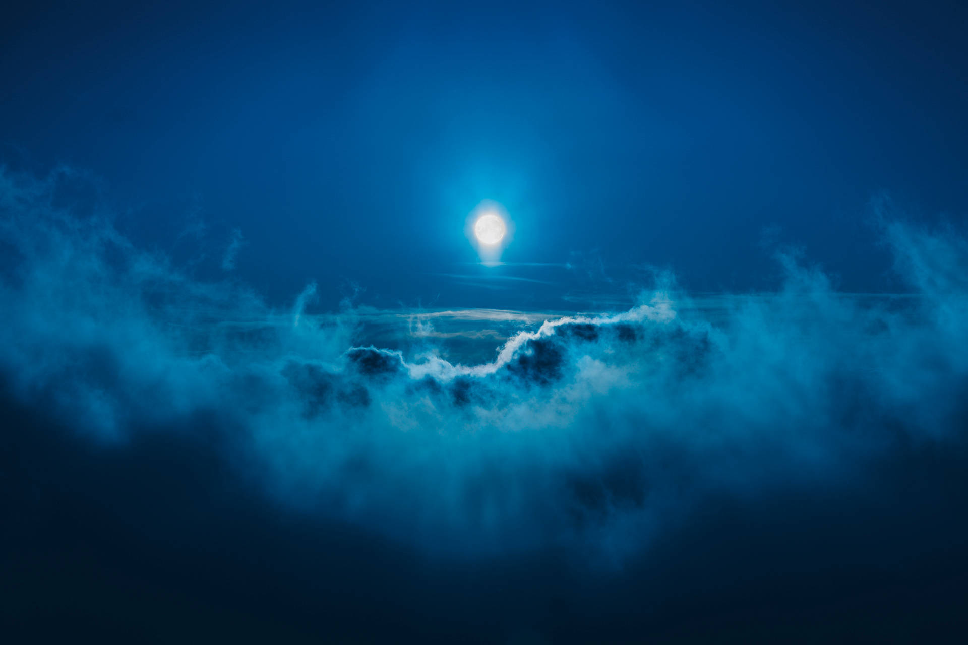 Full Moon Among Dark Blue Clouds Wallpaper