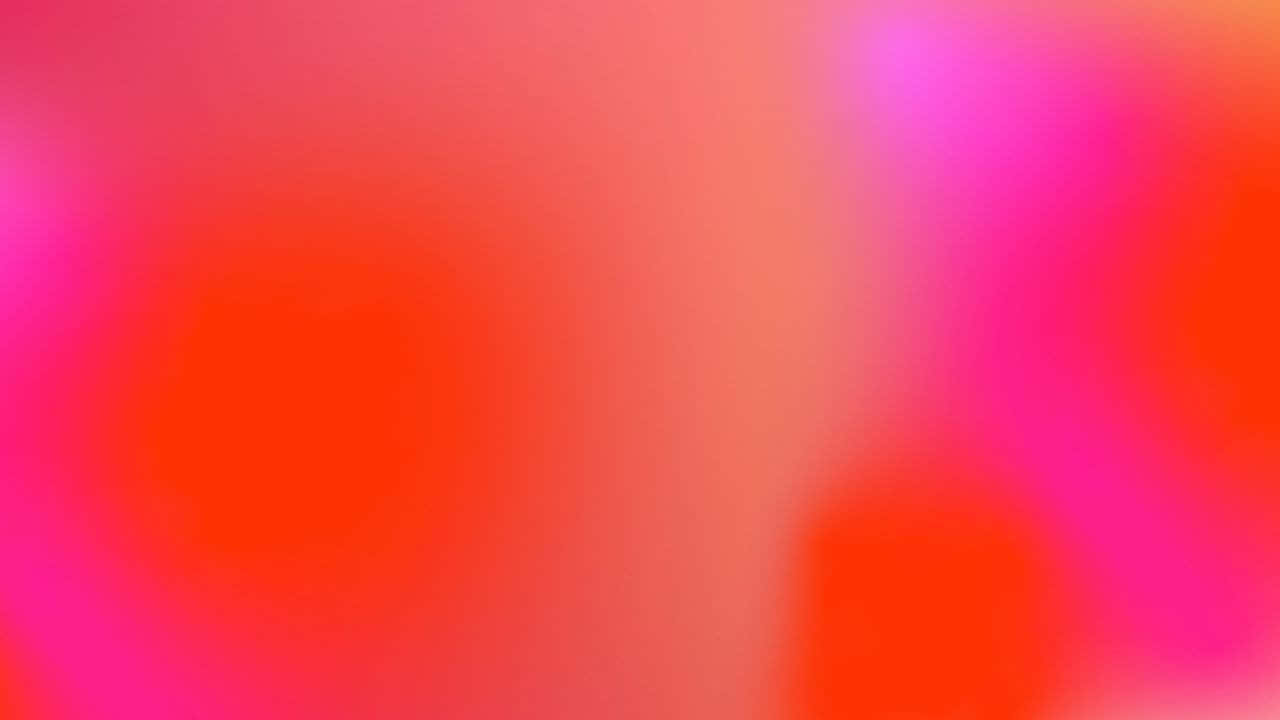 Download A Blurred Background With Pink And Orange Colors | Wallpapers.com