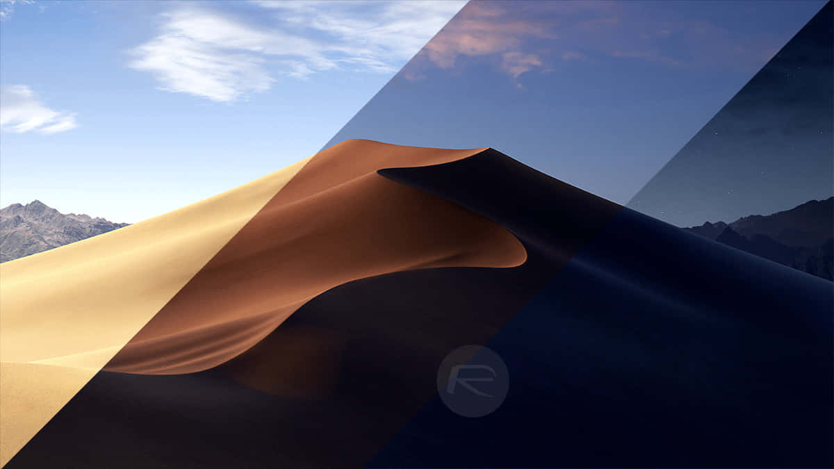 Unpaisaje De Desierto Con Una Montaña Al Fondo Fondo de pantalla