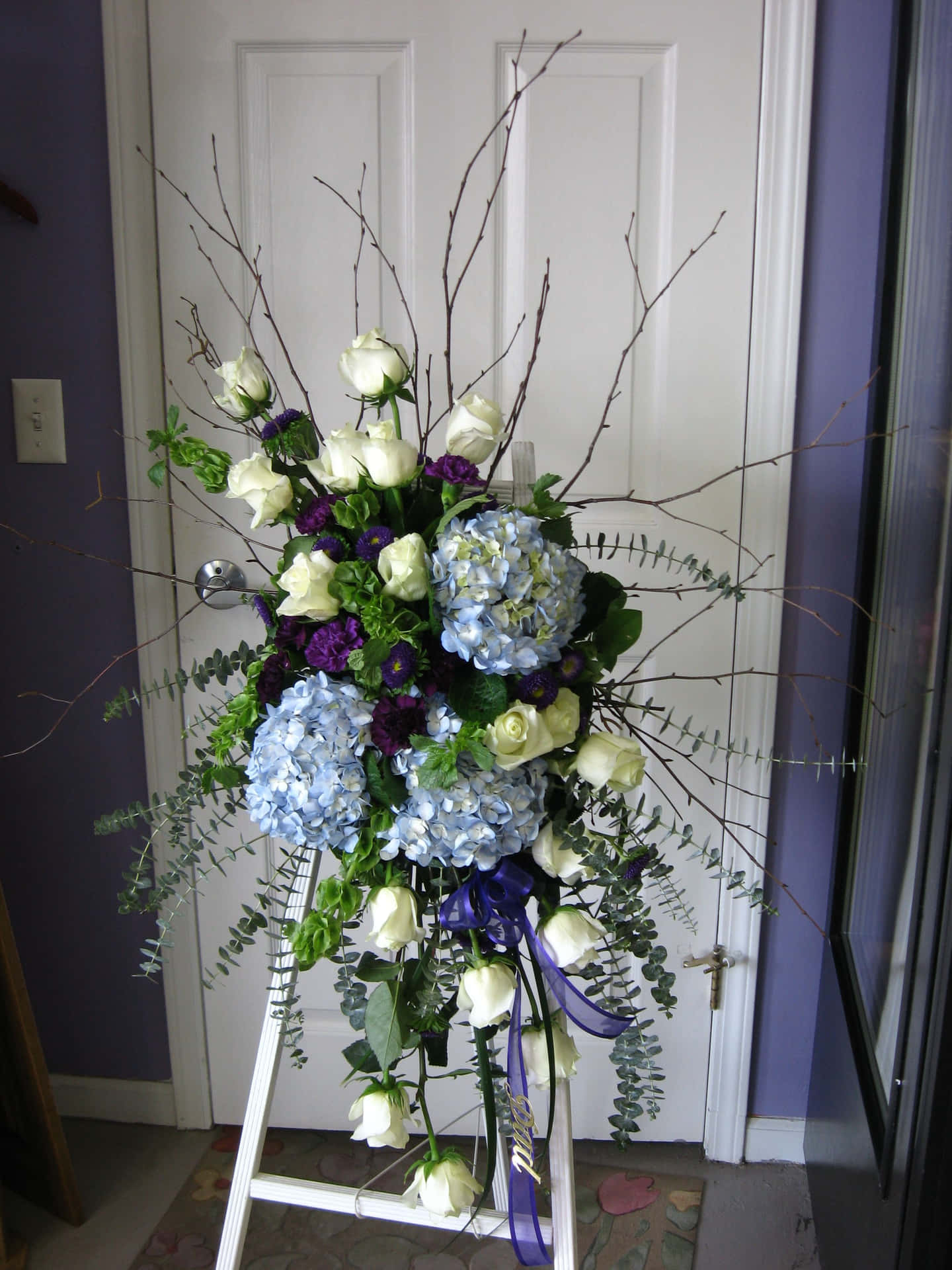 A White Door With A Wreath