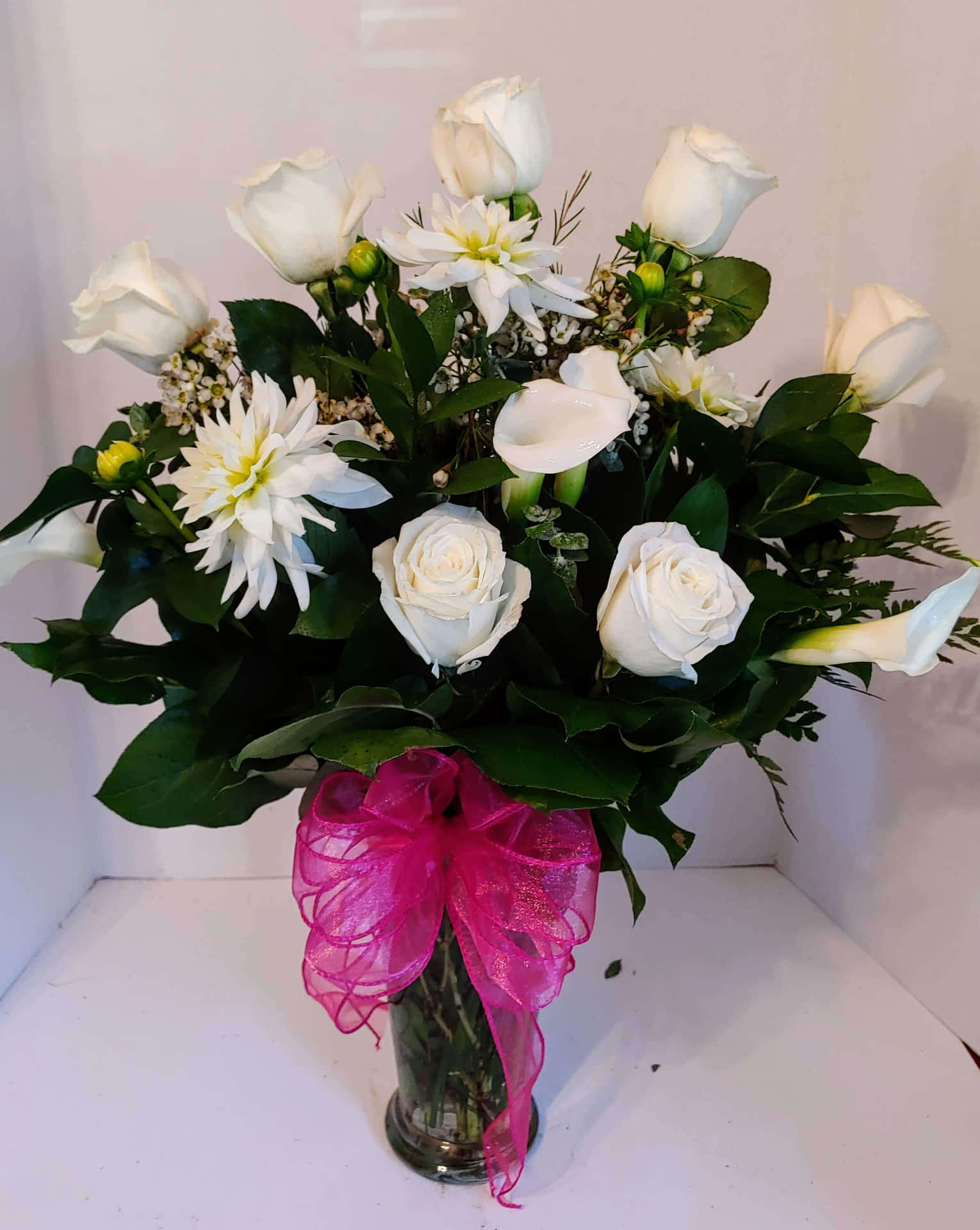 White Roses And Calla Lilies In A Vase