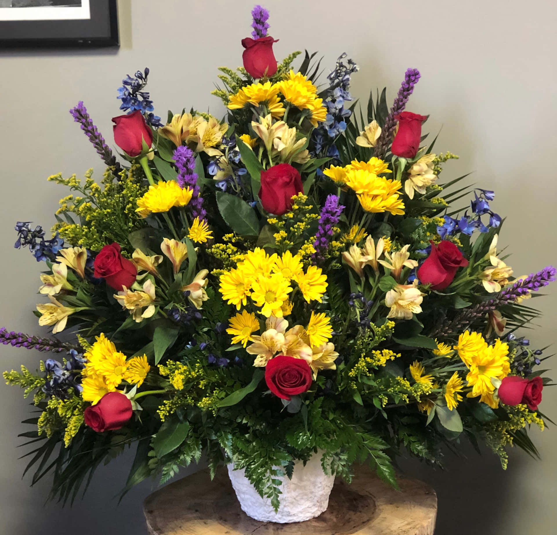 A Yellow And Red Arrangement In A Vase