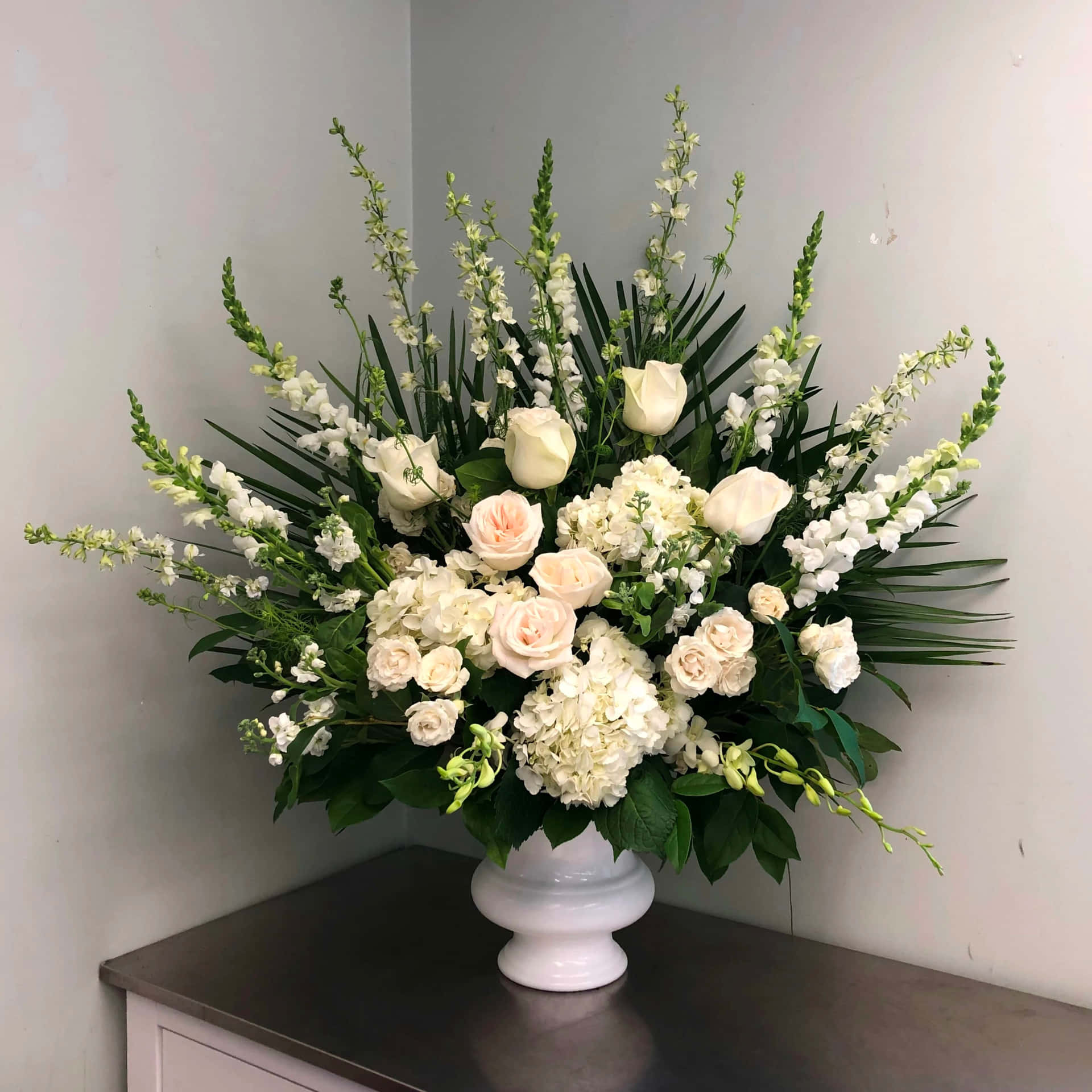 White Funeral Arrangement In A Vase