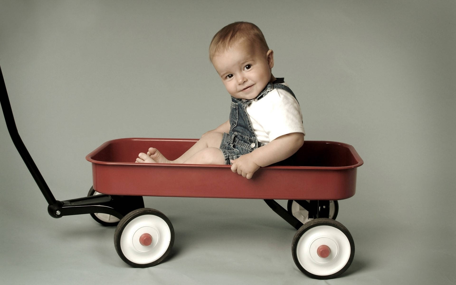 Funny Baby On A Wagon Wallpaper