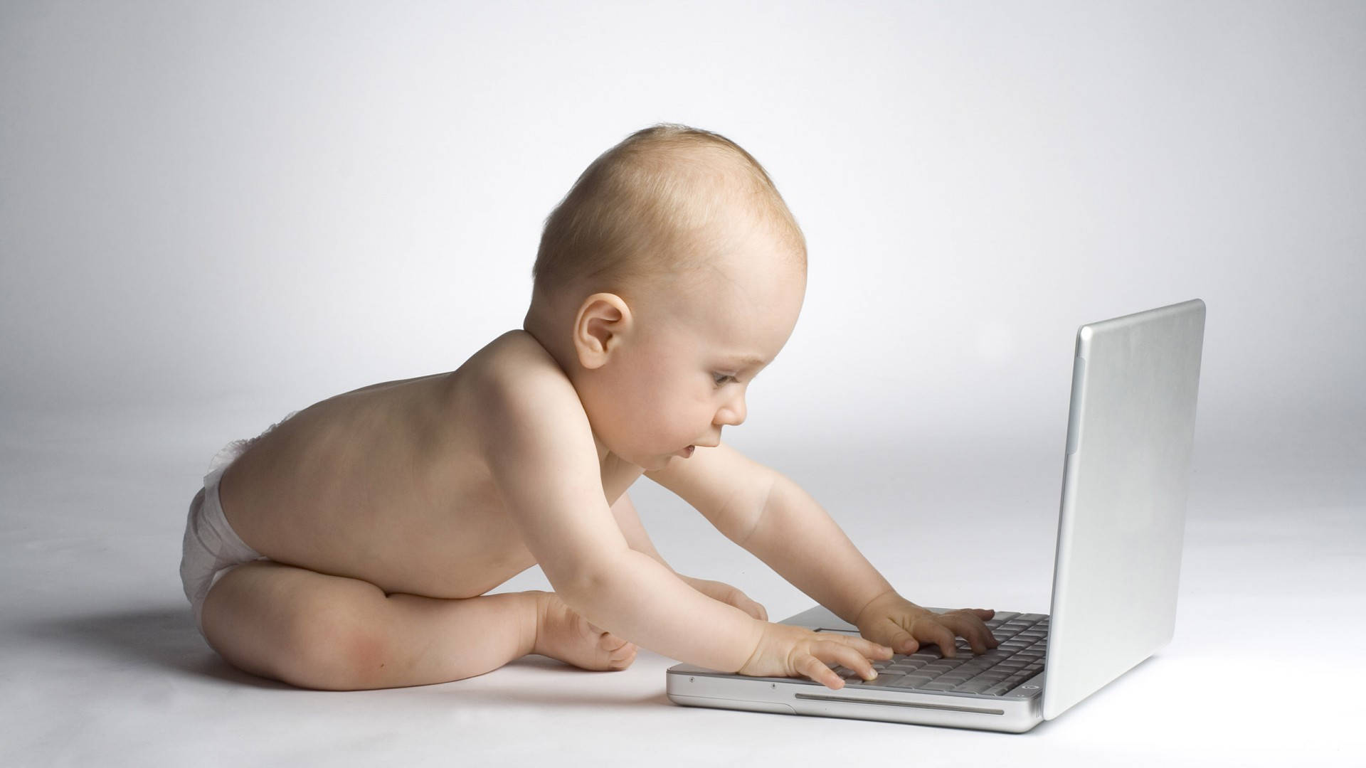 Funny Baby With A Laptop Wallpaper