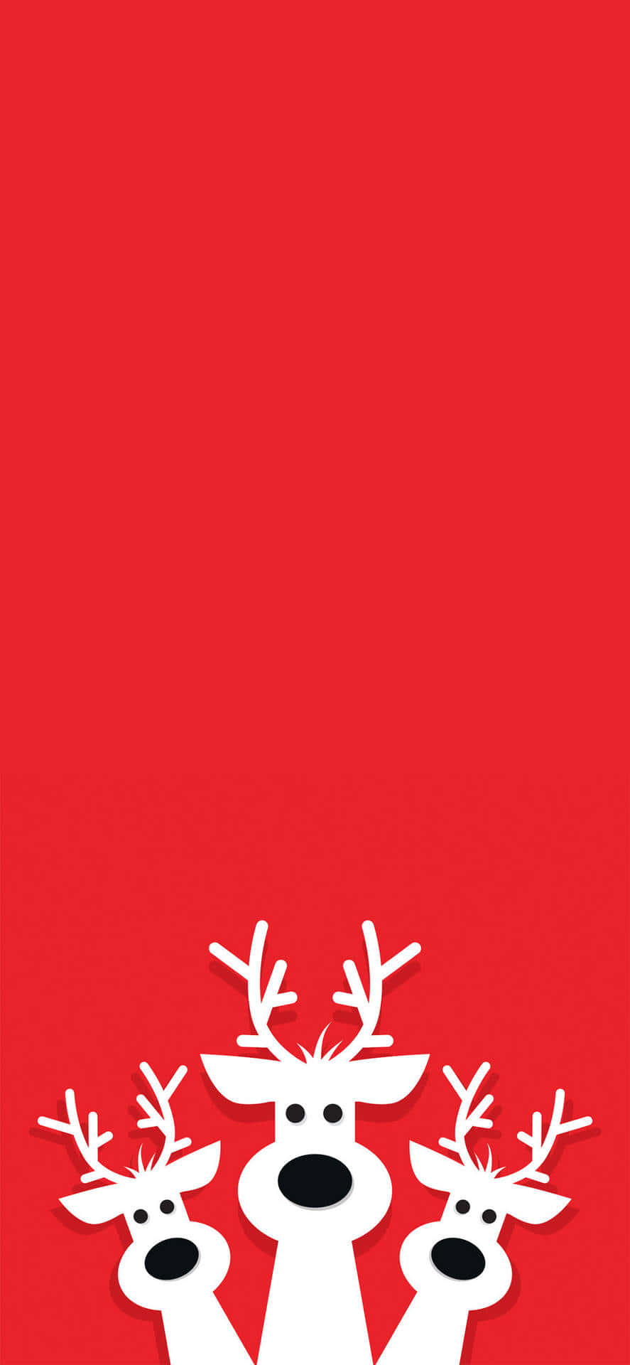 Julrenarpå Röd Bakgrund Wallpaper