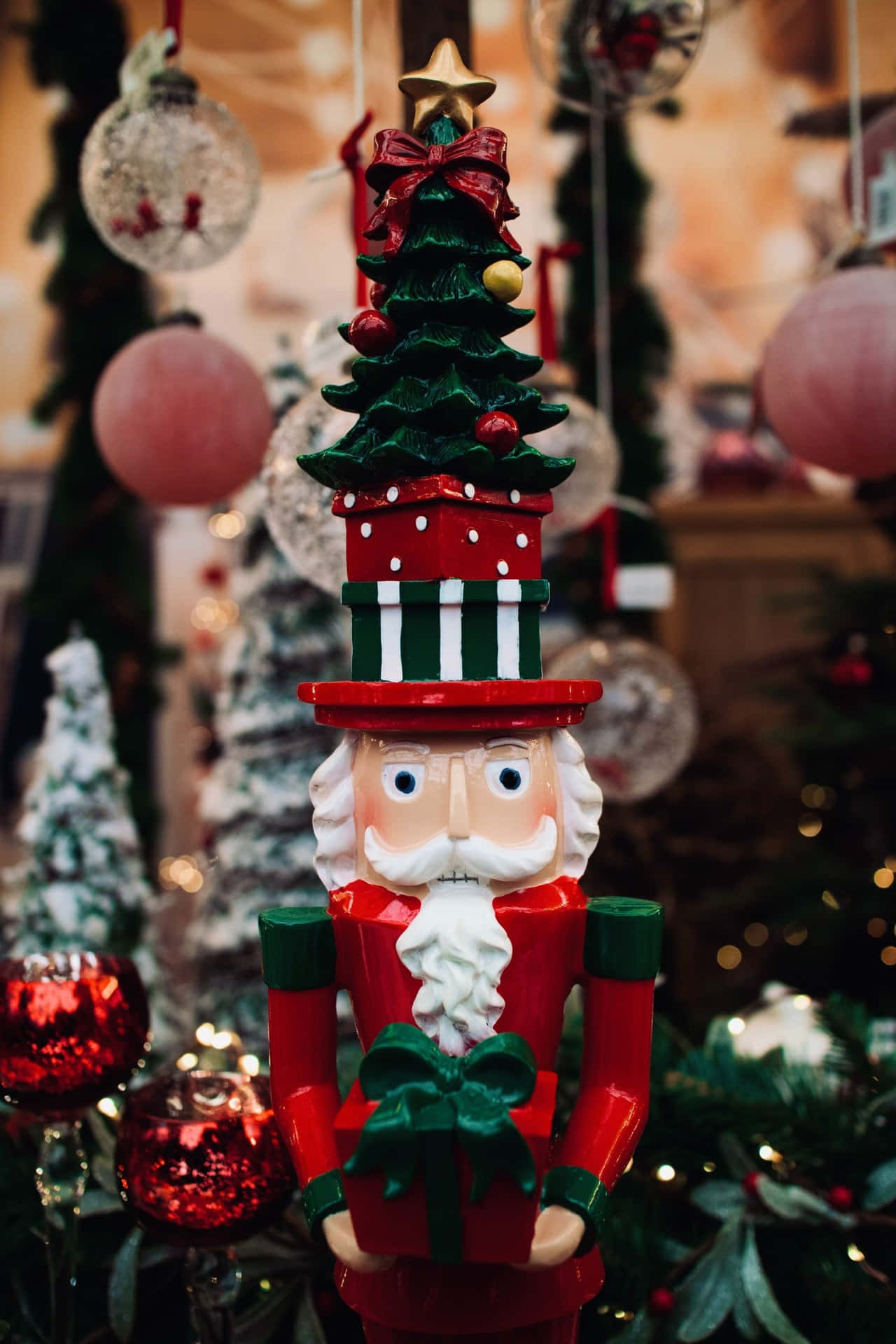A Nutcracker With A Christmas Tree In Front Of A Christmas Tree Wallpaper