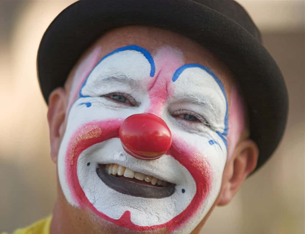 Immaginidi Un Clown Divertente Con Un Sorriso Luminoso.