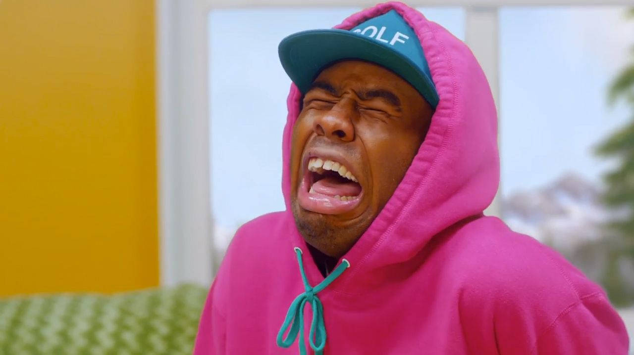 Tyler the Creator bursting into fits of laughter Wallpaper