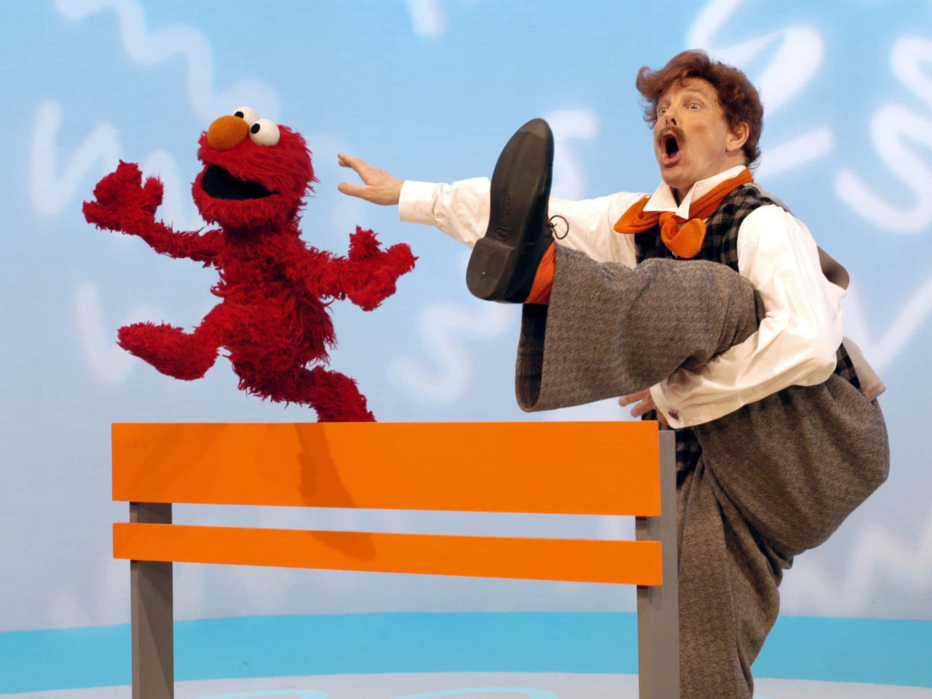 Funny Elmo And Mr. Noodle Stretching Picture