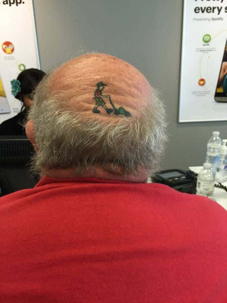 Funny People Mowing Grass Head Tattoo Picture