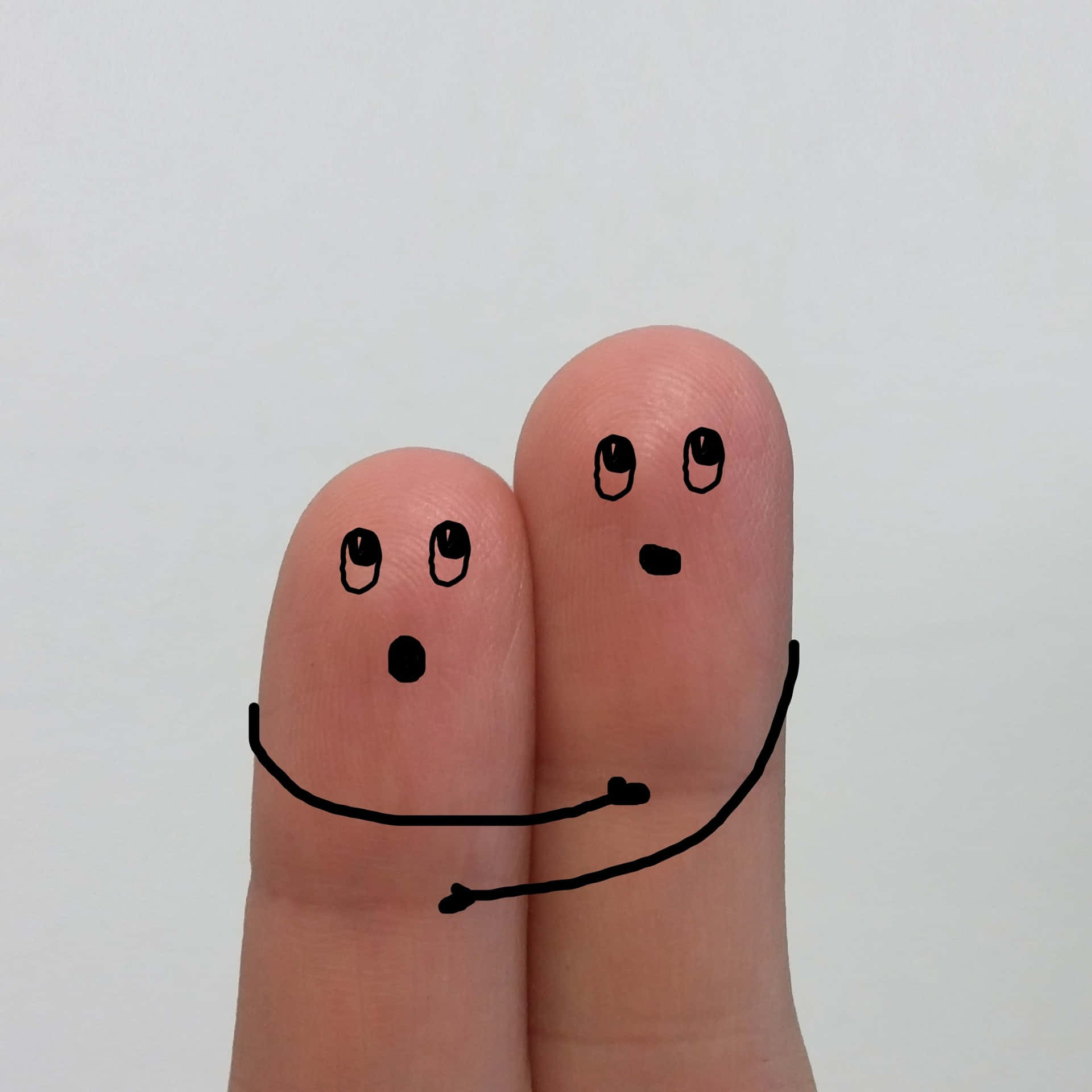 Funny Photo Of Two Tangible Fingers With Faces And Arms Drawn Wallpaper