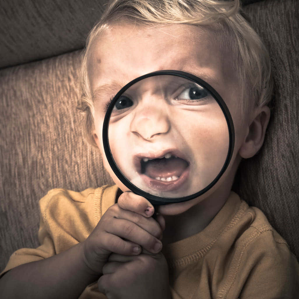 Funny Scary Little Boy With Magnifying Glass Picture