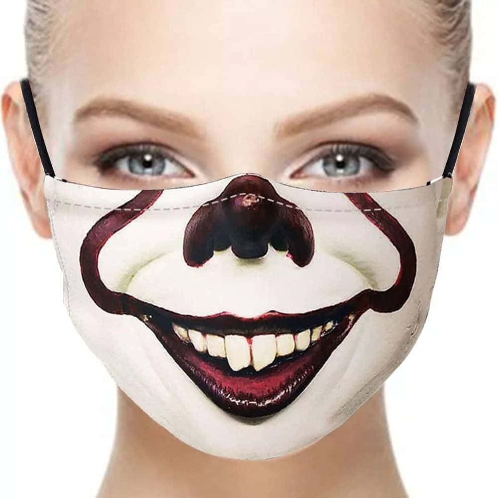Sjov skræmmende pige iført clown maske billede