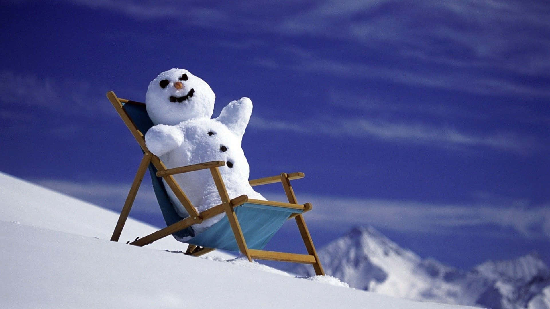 Witzigesbild: Schneemann Auf Einem Stuhl Im Schnee