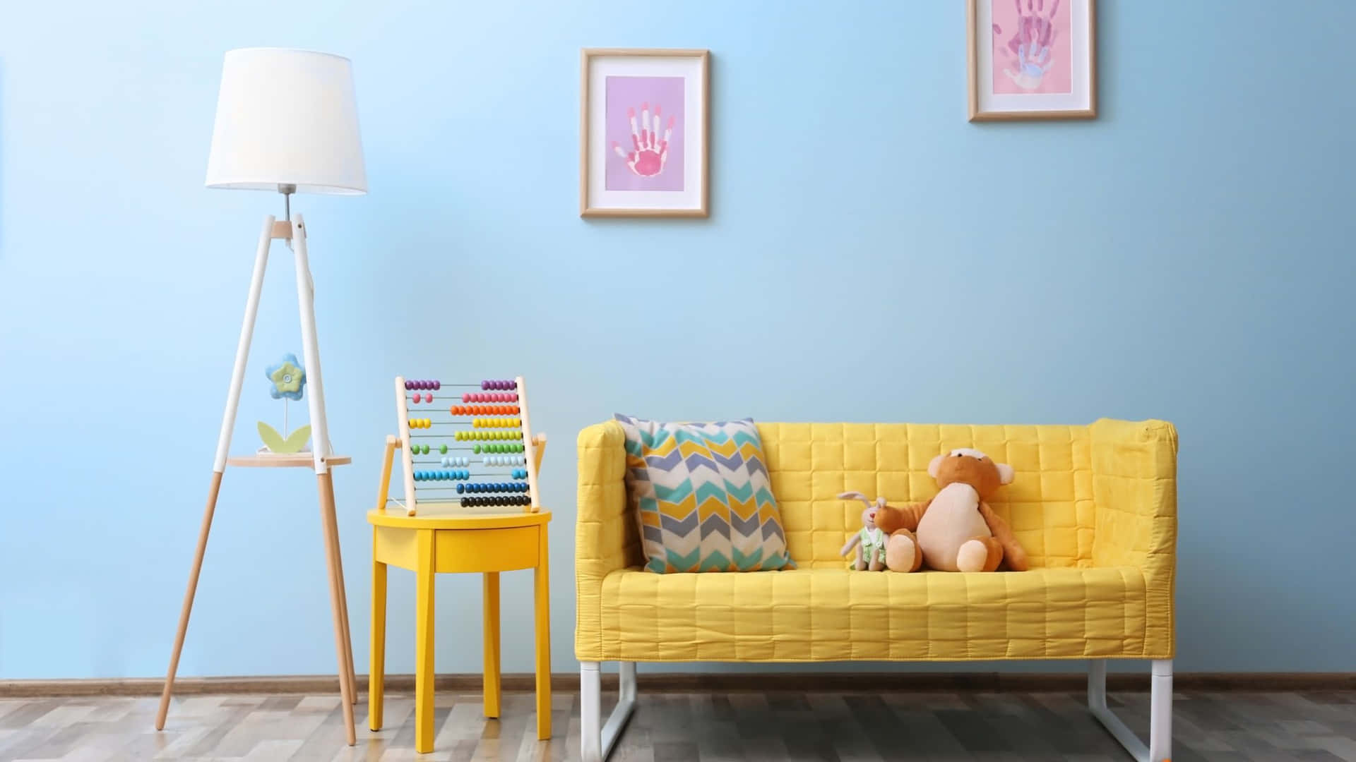 A Yellow Couch And A Stuffed Animal In A Room With Blue Walls
