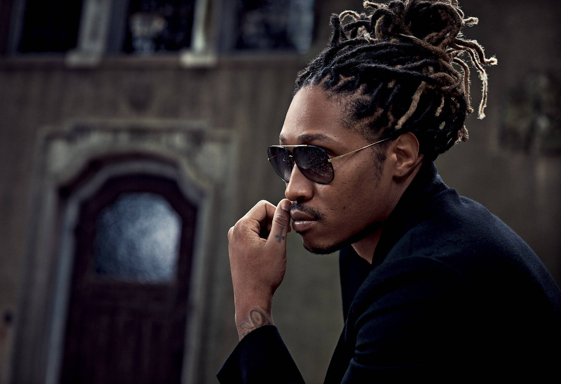 Future Rapper Sitting Sideview Wallpaper