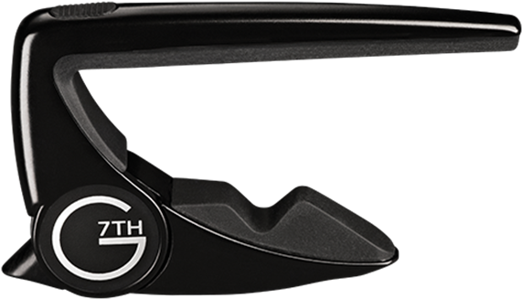 Futuristic Black Sunglasses PNG — A sleek black guitar capo with a circular logo reading 7TH G against a plain white background.