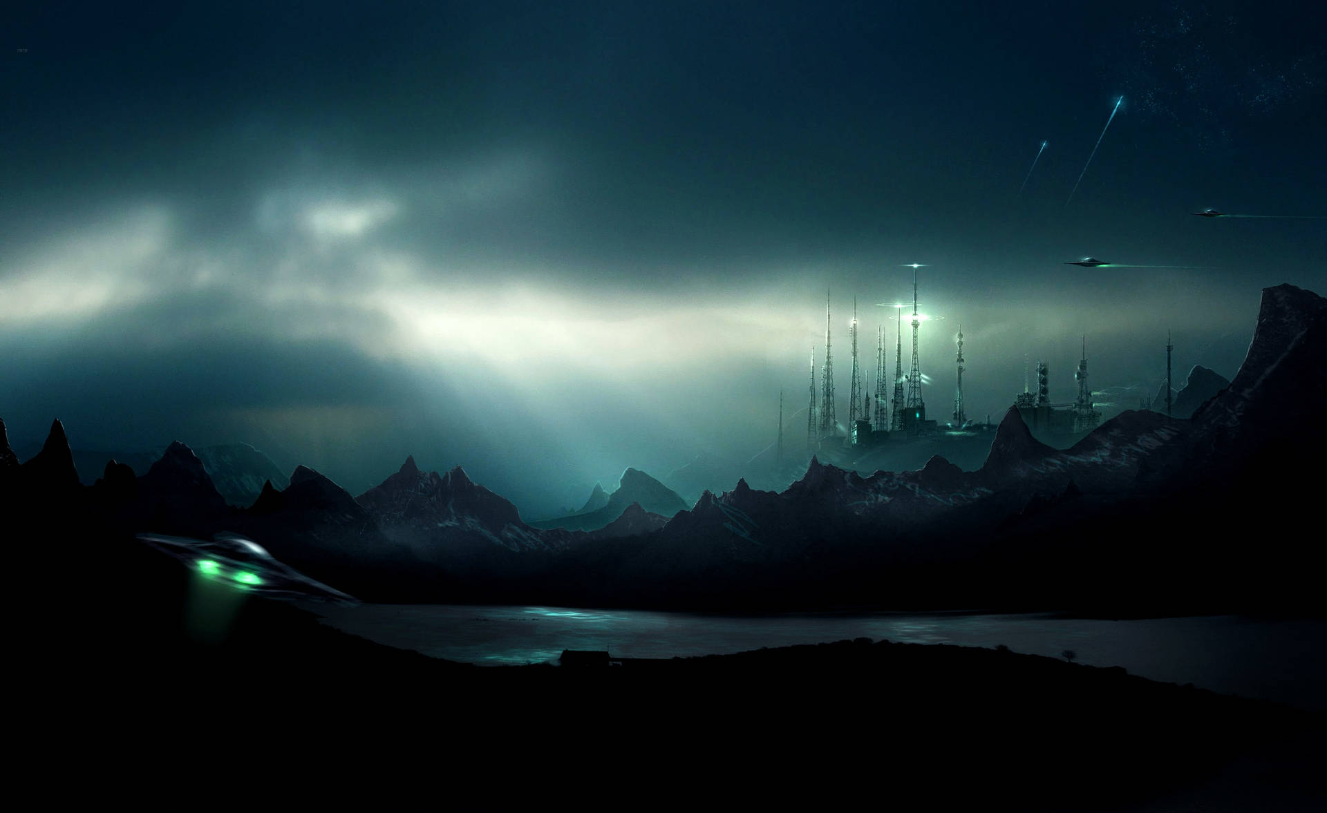 A Dark Night Scene With A City And Mountains Wallpaper