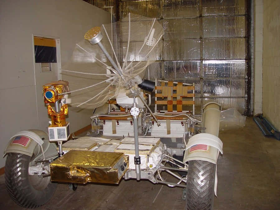 Futuristic Lunar Rover Exploring Moon Surface Wallpaper