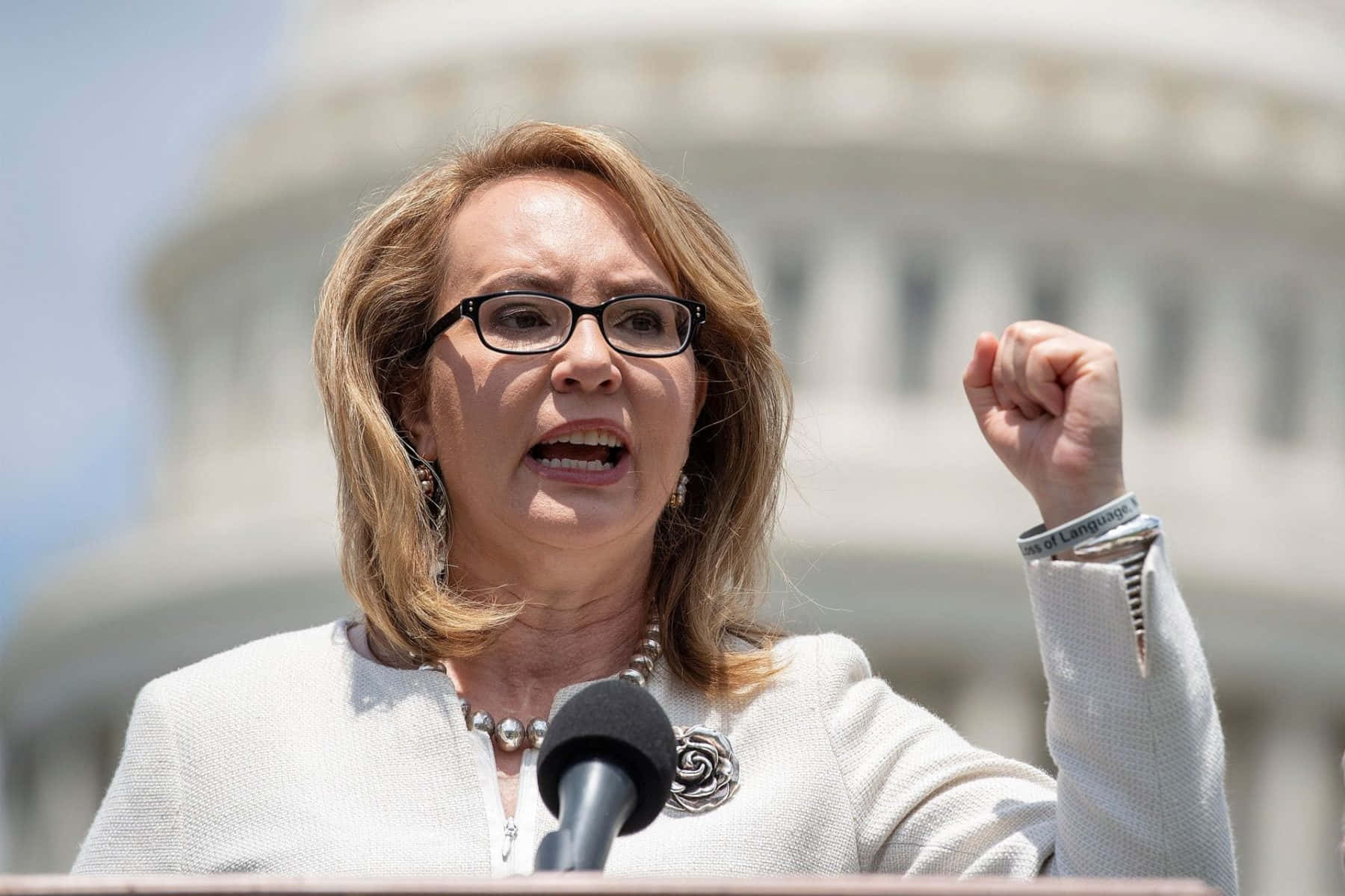 Gabrielle Giffords Speaking Passionately At A Public Event Wallpaper