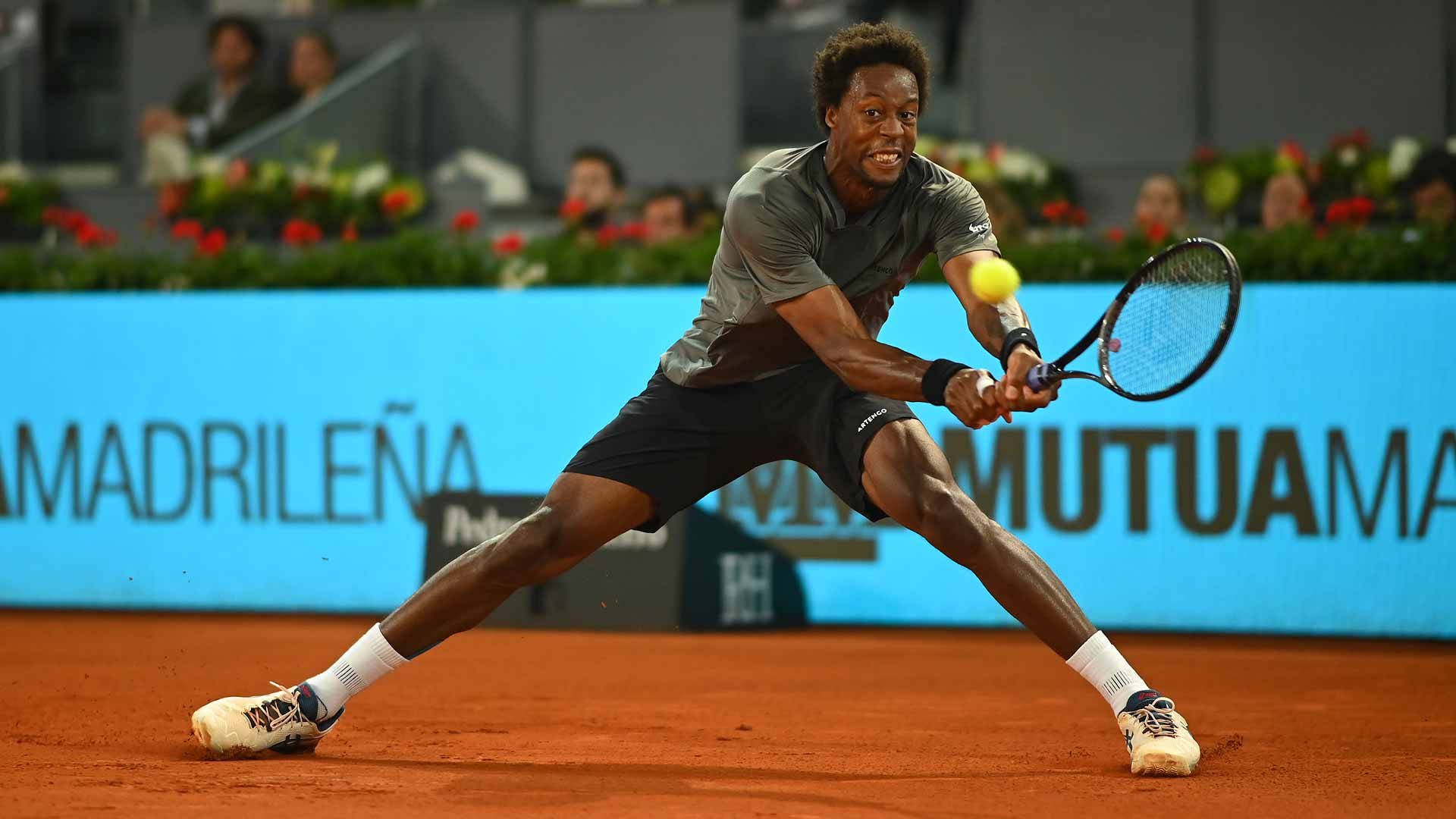 Caption: Gael Monfils in action on court Wallpaper