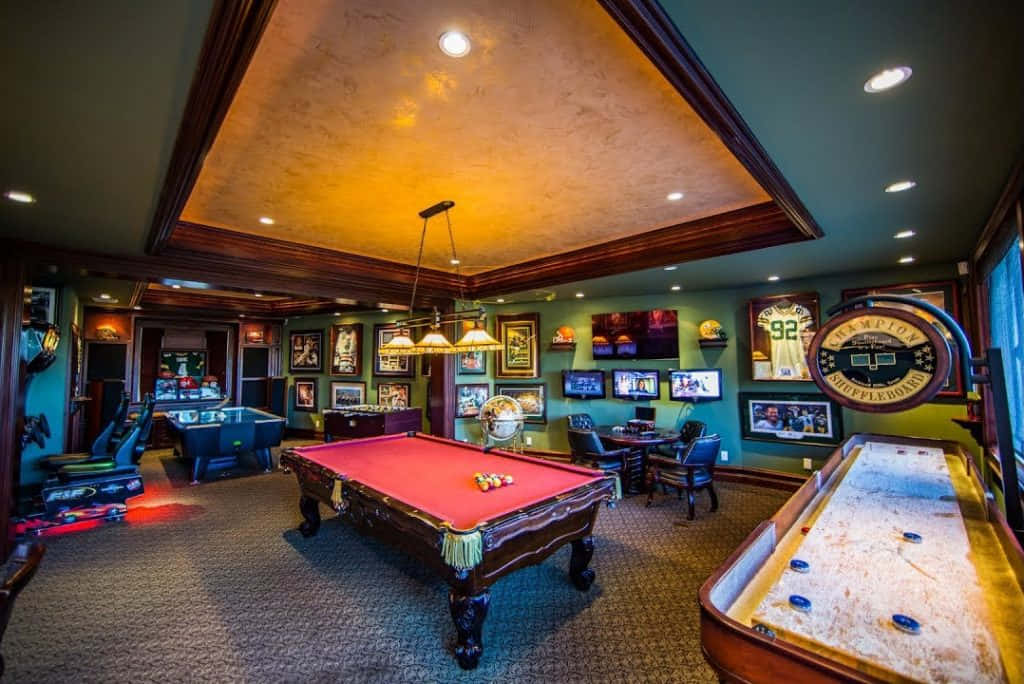 A Game Room With A Pool Table And Other Games