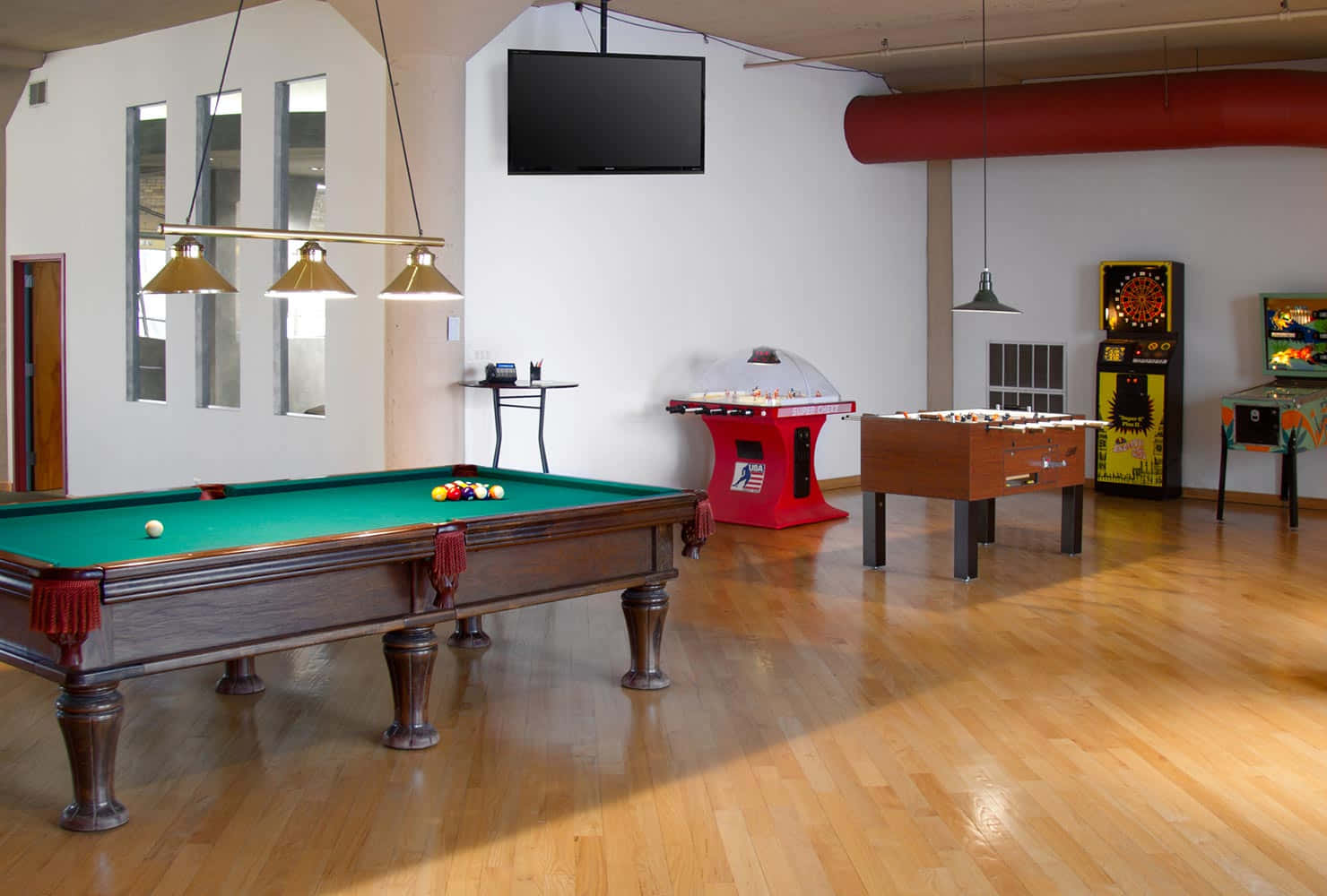 A Room With A Pool Table And Other Games