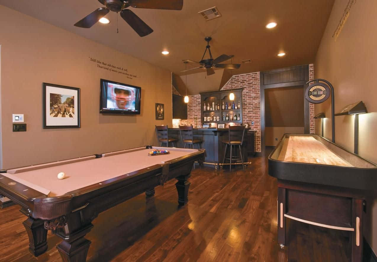 A Game Room With A Pool Table And A Bar