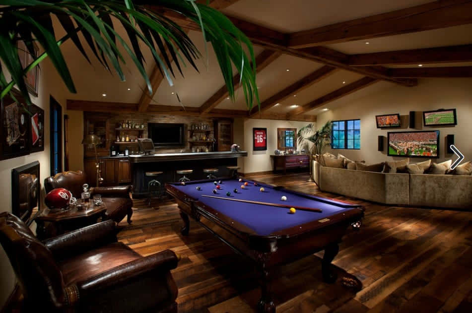 A Pool Table And A Couch In A Home