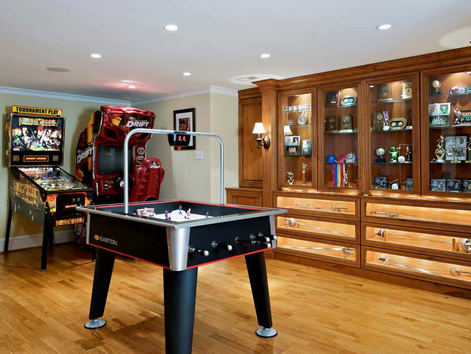 A Home Game Room With A Pool Table And A Foosball Table