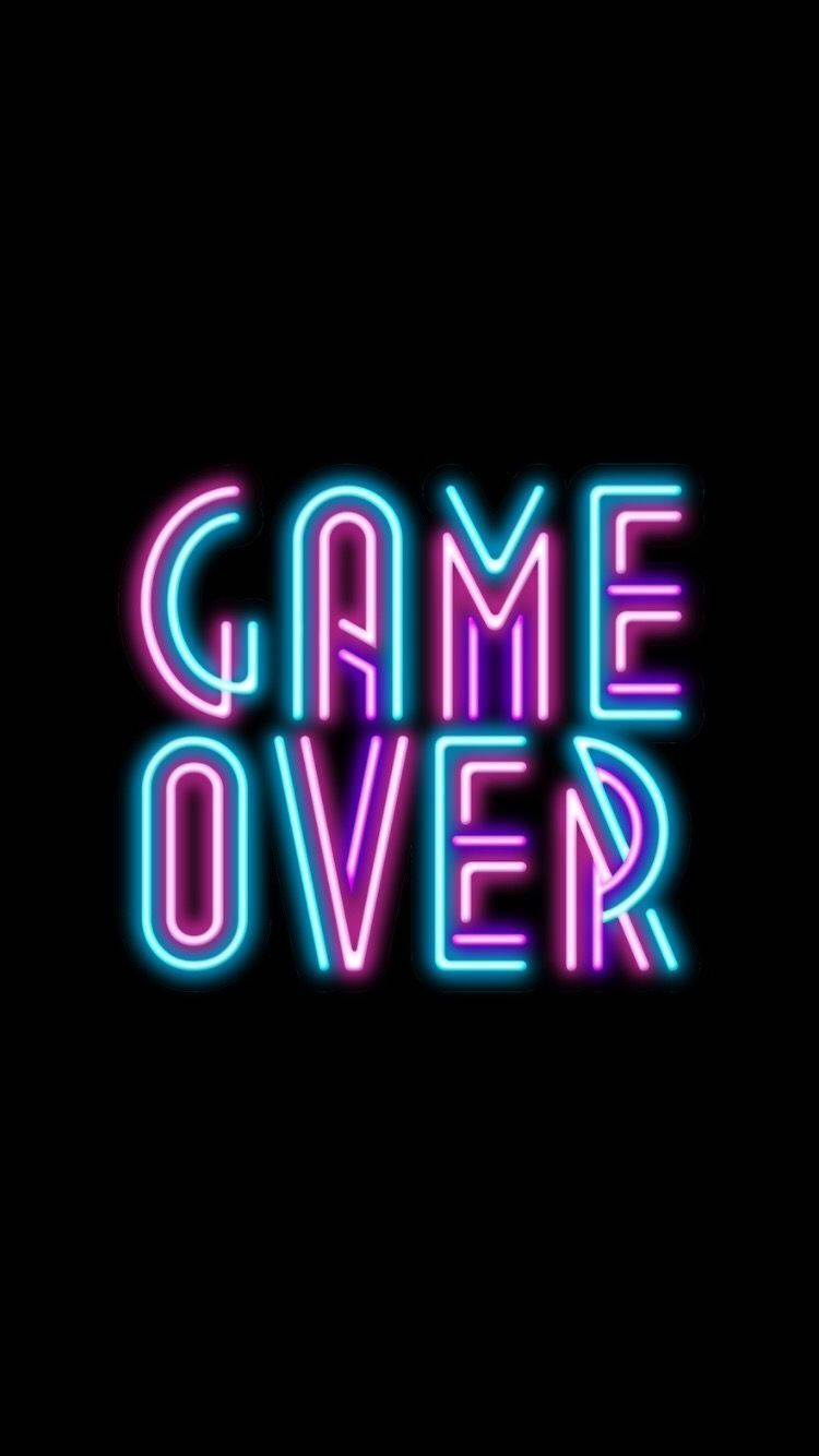 Neon Game Over Wallpaper — Vibrant neon pink and blue 'GAME OVER' text glows against a stark black background.