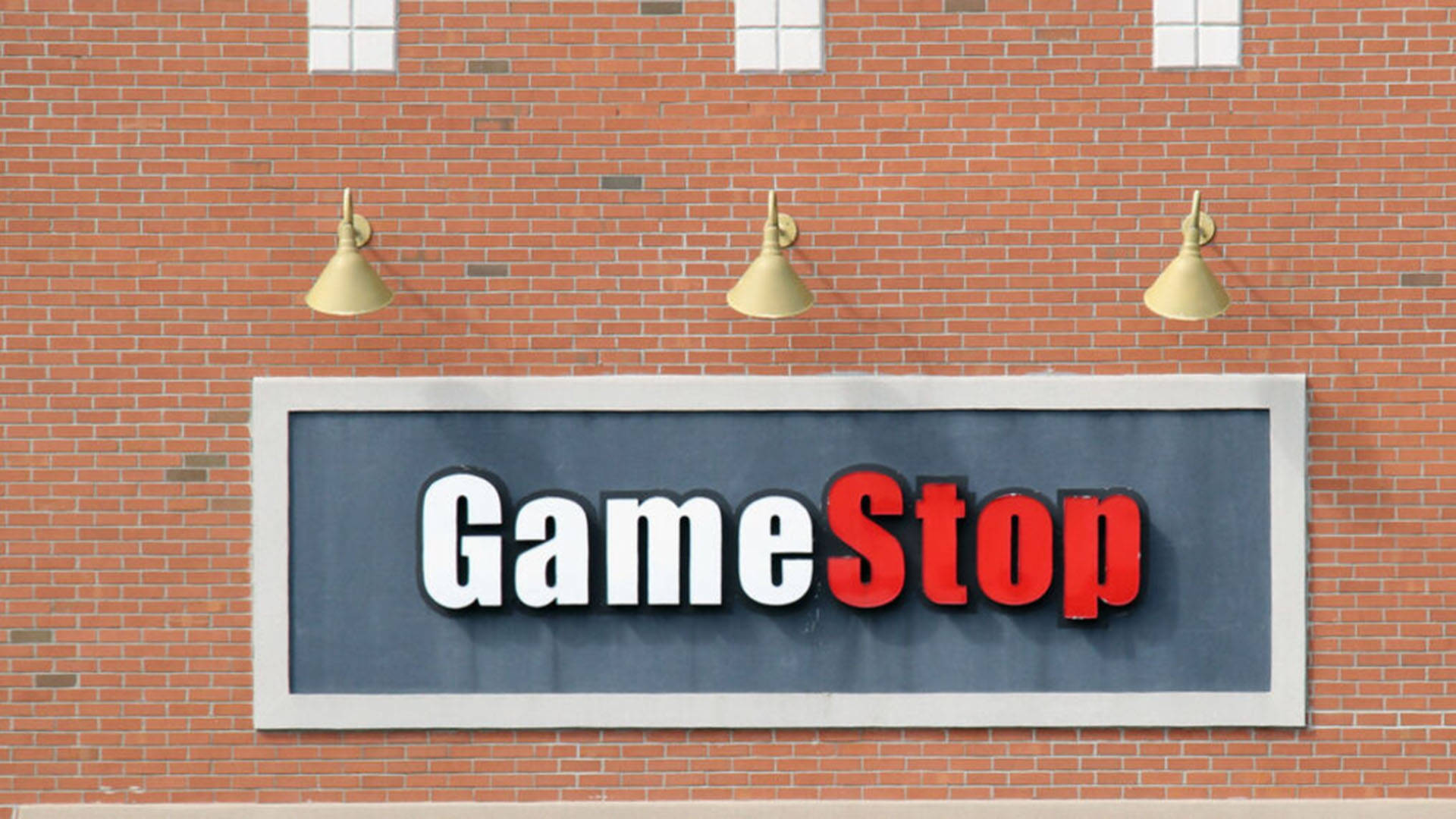 GameStop Orange Brick Wall Sign Background