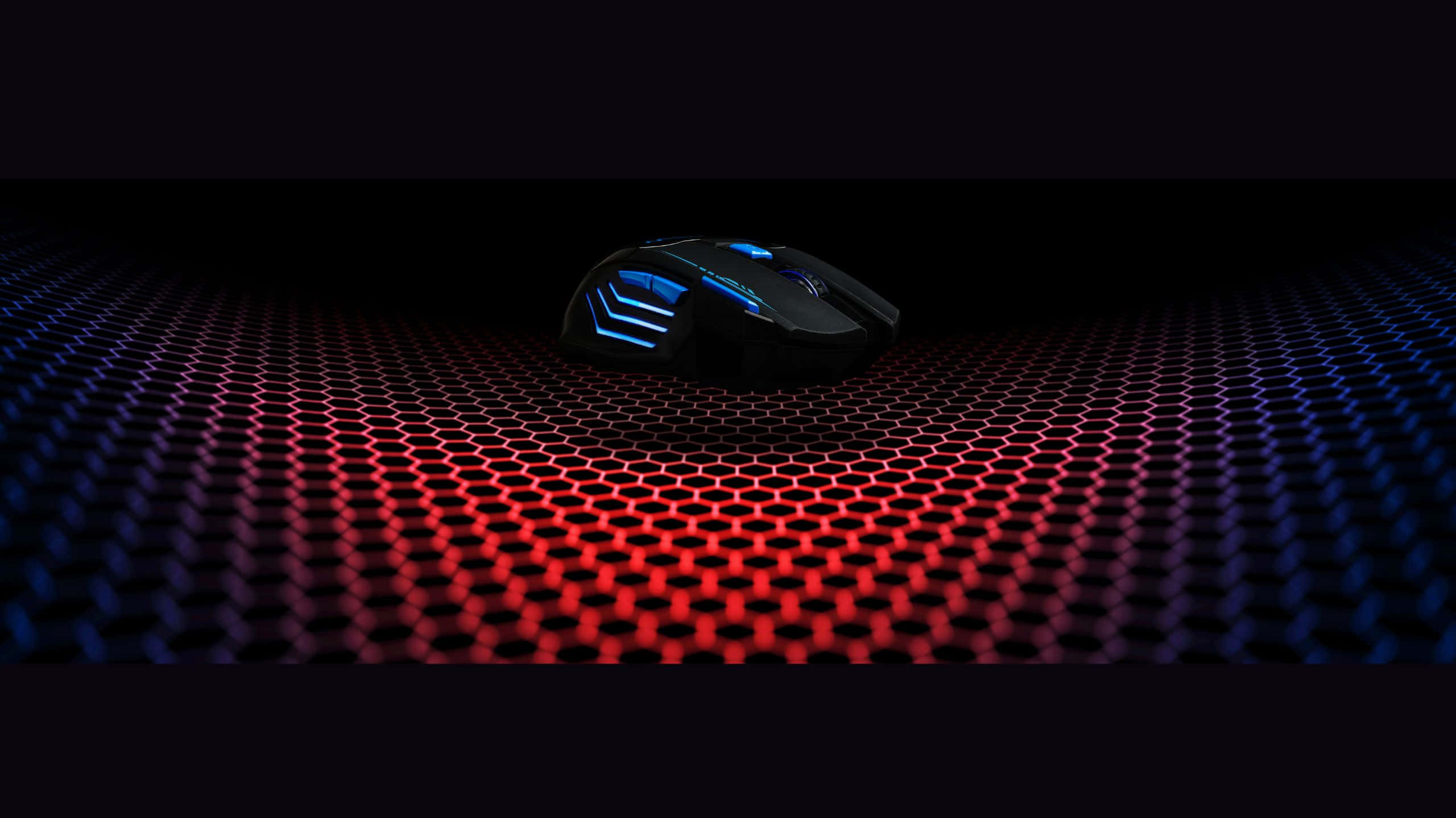 A Blue And Red Mouse On A Black Background