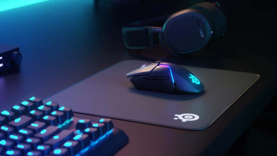 Sleek Gaming Mouse on Vibrant Background Wallpaper
